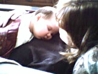 Linnea sleeping on Mom.